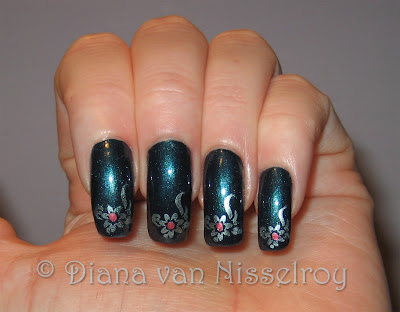 are made with a dotting tool and China Glaze Emotion. Photo with flash