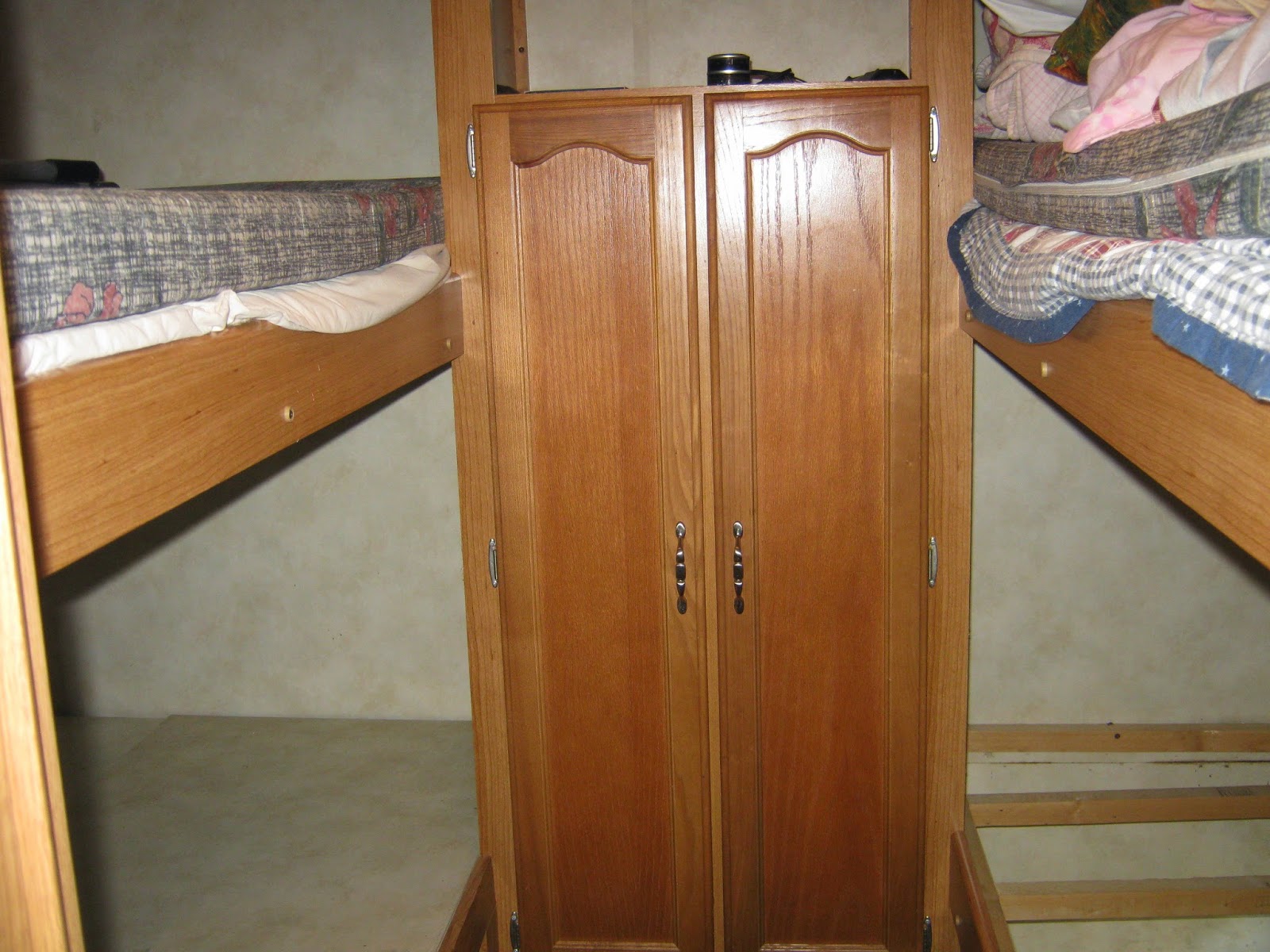 Puma travel trailer water damage RV repair renovate flooring bunk room wardrobe TV cabinet http://makingmemoriesrv.blogspot.com/