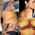 Feather,ink,skull,and star tattoo on Rihanna body