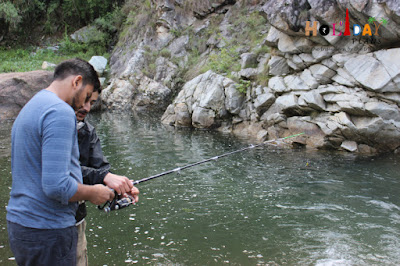 Divyam learning how to operate a fishing rod Divyam learning how to operate a fishing rod