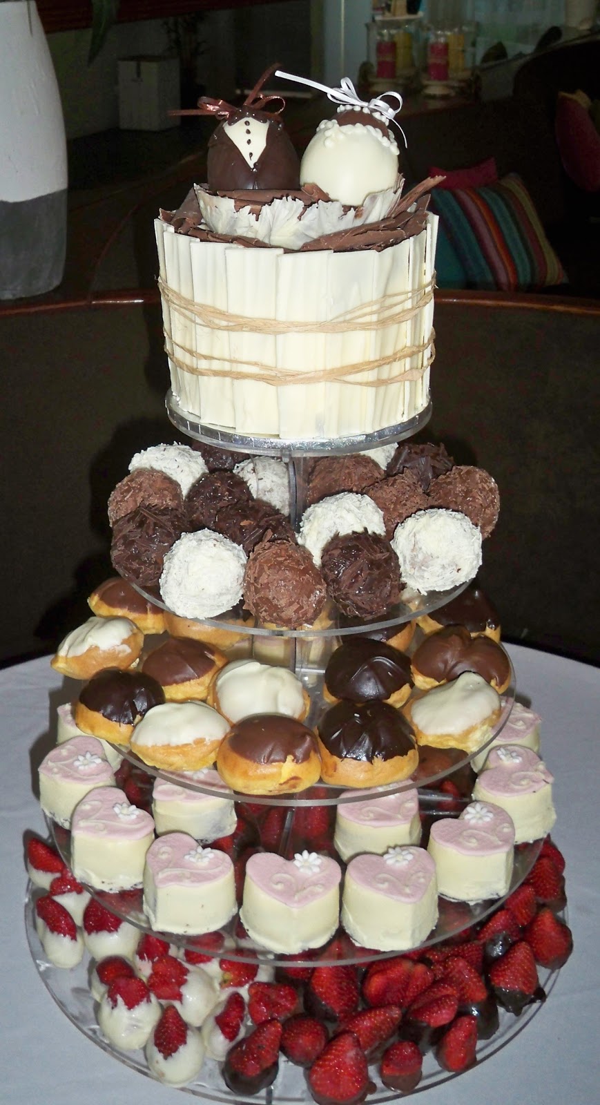 Mixed goodies tower chocolate truffles, profiteroles individual heart