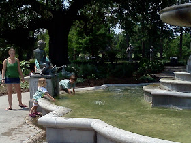 Children playing at the fountain