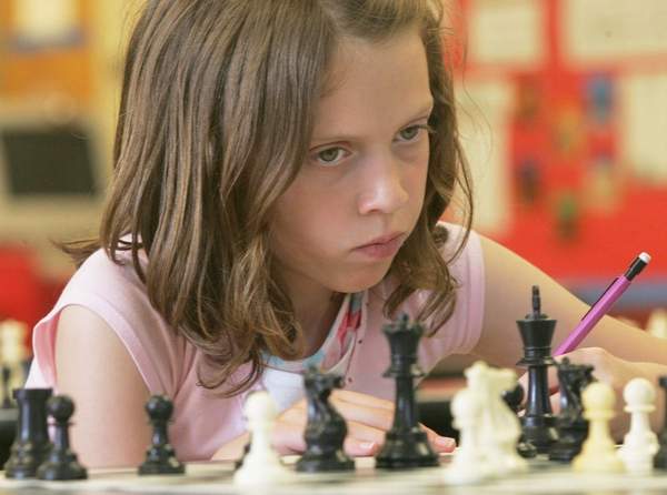 girl playing chess