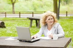 “Business Lady Using Laptop In Park” by adams FreeDigitalPhotos.net