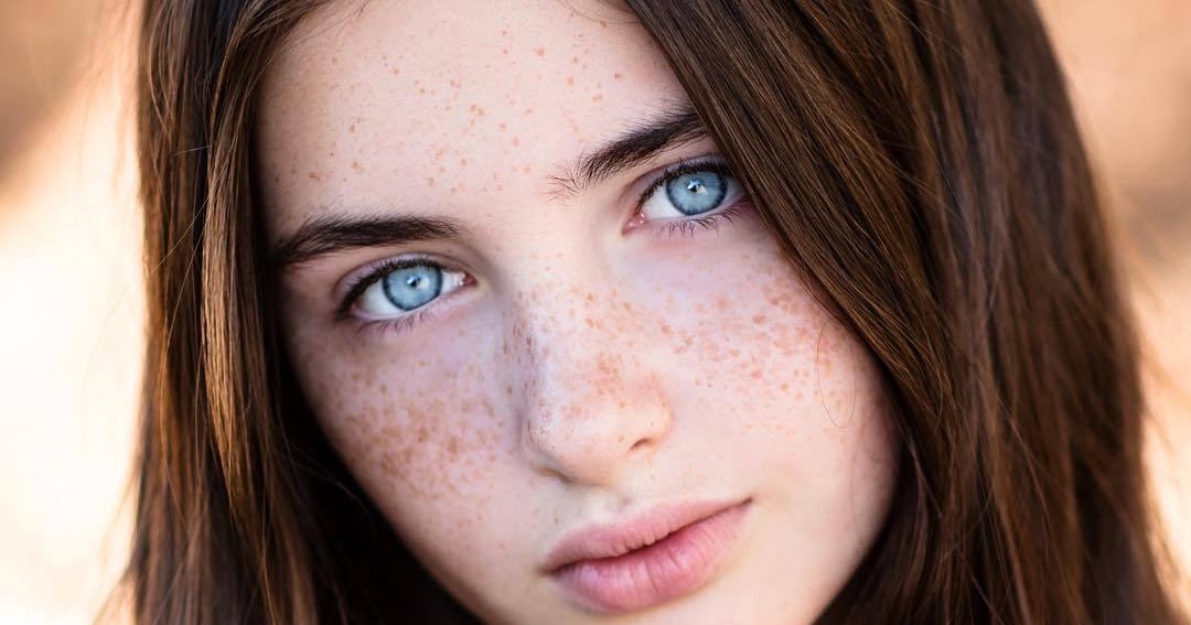 Dark Haired Girl With Freckles