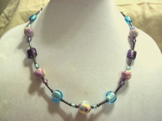 https://www.etsy.com/listing/161896663/ooak-purple-and-blue-polymer-clay-beaded?ref=shop_home_active_3