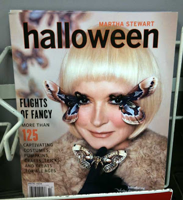 Cover of Martha Stewart Halloween magazine with Martha in ice-blond wig and false eyelashes made from half a huge moth on each eye