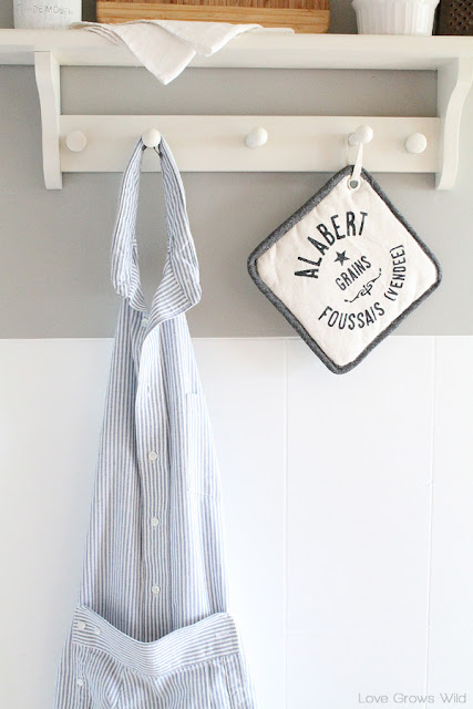 Learn how to make this sweet apron from a men's dress shirt so you can look cute while you cook! Perfect for beginner sewers! | LoveGrowsWild.com 