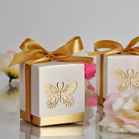 http://www.specialgiftboxes.com/product/gold-laser-cut-butterfly-favor-box-set-of-12/