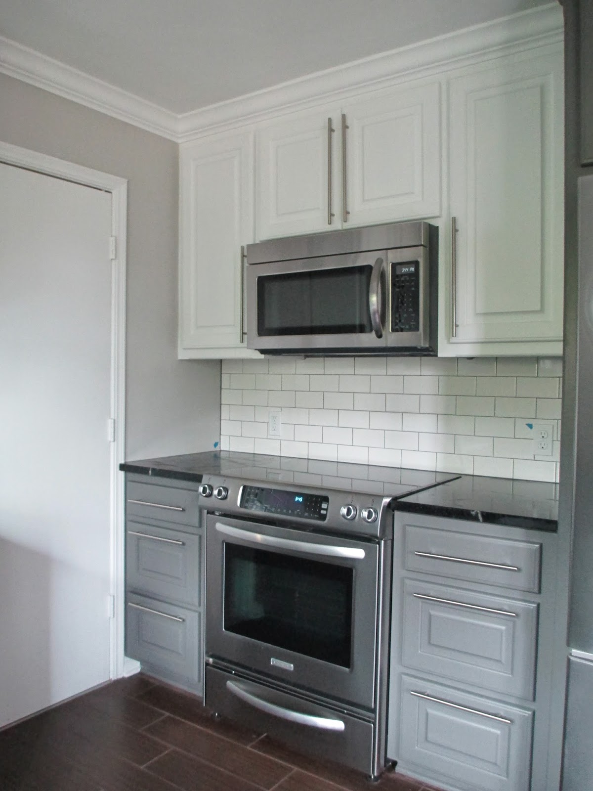 Shiloh kitchen cabinets Benjamin Moore on the lower cabinets, and white on the upper cabinets