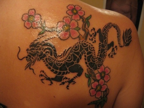 Women tattoo with dragon tattoos