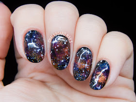 Jewel-toned galaxy nails by @chalkboardnails