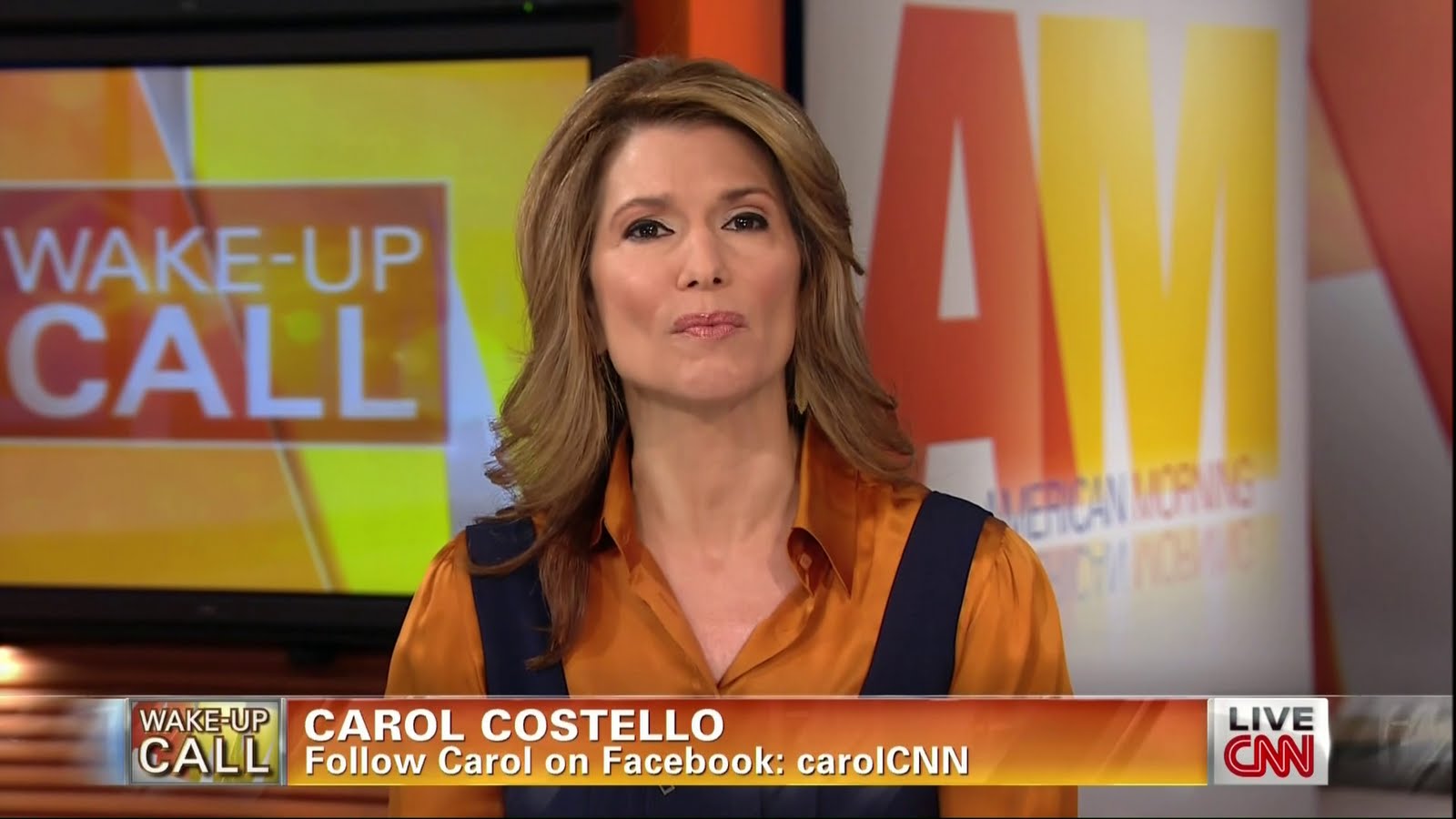 Ladies in Satin Blouses: Carol Costello - orange satin blouse under jumper