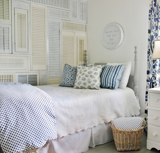 Old shutters wall art in a bedroom by Thistlewood Farms featured on I Love That Junk
