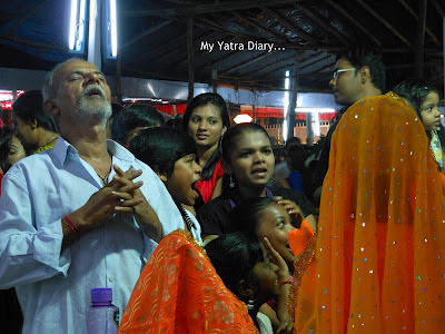 A devotee in deep prayer ahead of the final ritual of Ganesh Chaturthi festival