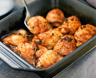 Lemon-spiced Chicken: Classic dish of marinated chicken thighs roasted with lemon juice, spices and herbs