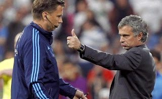 Mourinho faces a referee in a UEFA match