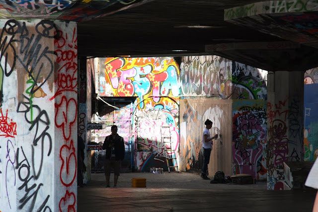 A Graffiti Artist at Work, South Bank Skate Park, London A Graffiti Artist at Work, South Bank Skate Park, London