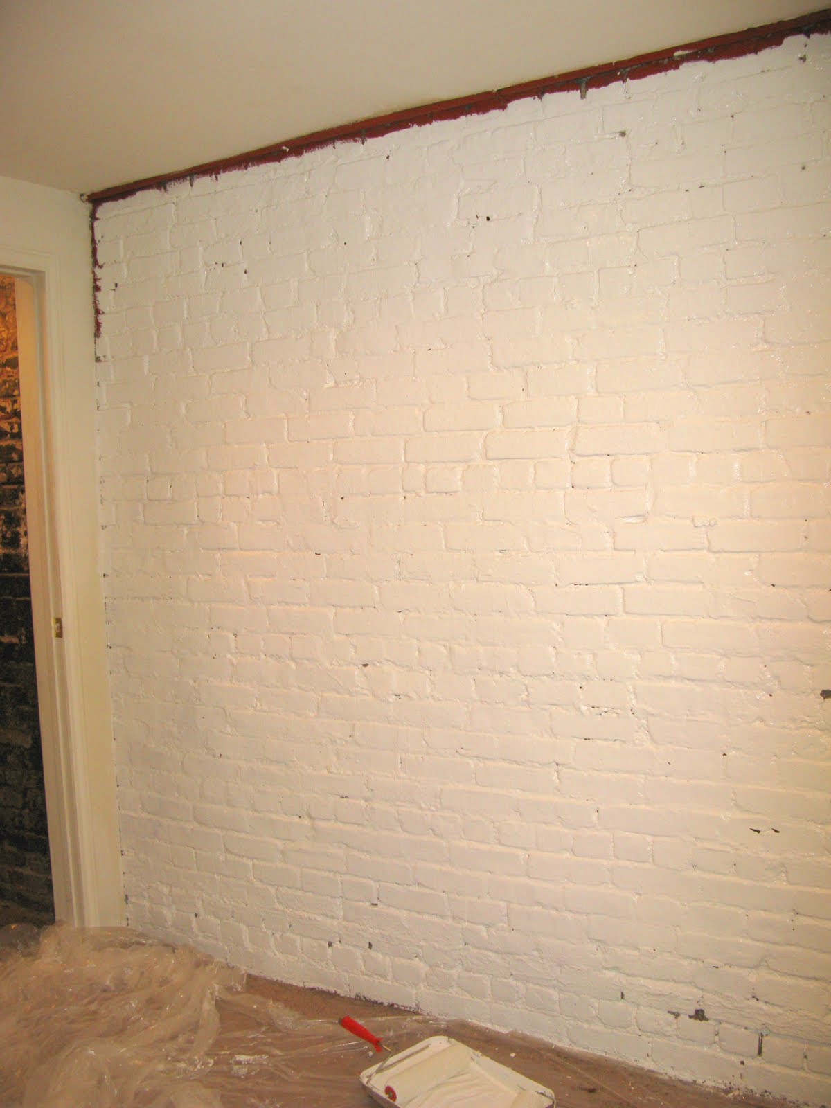 Making Our Brick Basement Apartment a Home Painting the Brick Wall