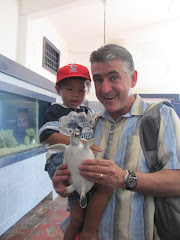 Mexico, Alexandre and Dad having fun with a turtle