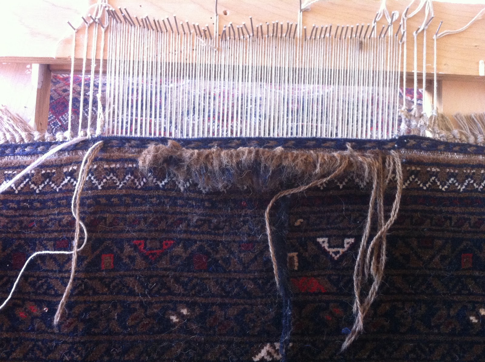 Kosker Traditional Rug Repair Repairing damaged fringes on an Oriental