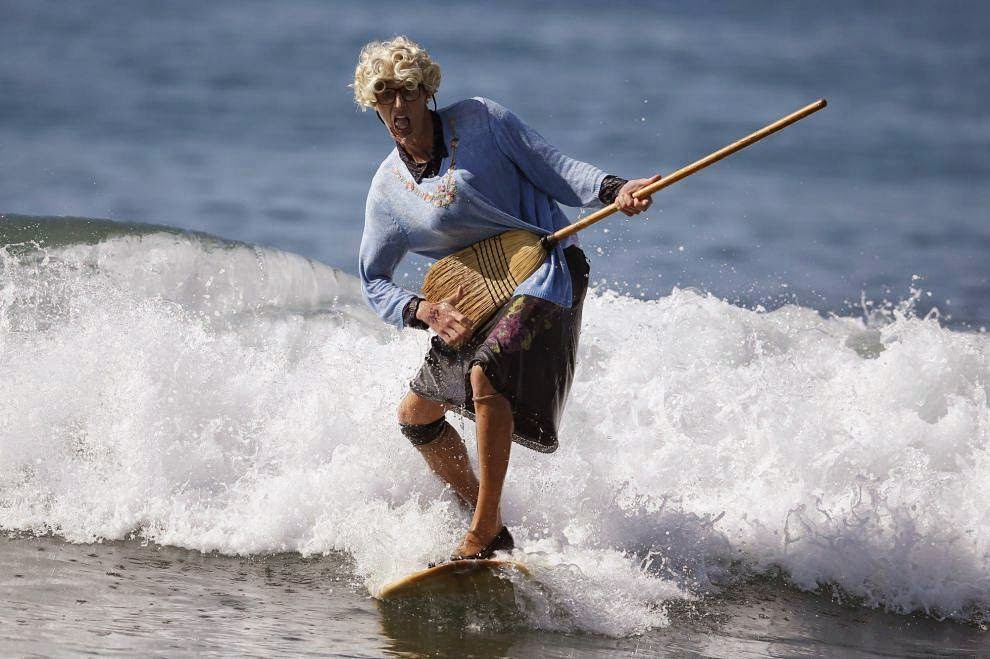 Halloween Surf Contest 2014 David Nickerson, 24, rides a wave dressed as Mrs Doubtfire during the 7th annual ZJ Boarding House Haunted Heats Halloween surf contest. (REUTERS/Lucy Nicholson)