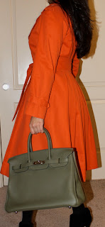 Bottega Veneta necklace, Calvin Klein opaque black stockings, Carolina Herrera dress and coat, Hermès Birkin, datejust Rolex Bottega Veneta necklace, Calvin Klein opaque black stockings, Carolina Herrera dress and coat, Hermès Birkin, datejust Rolex