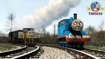 Little steam train Thomas the number one engine chuffed on with the Sodor diesels following behind