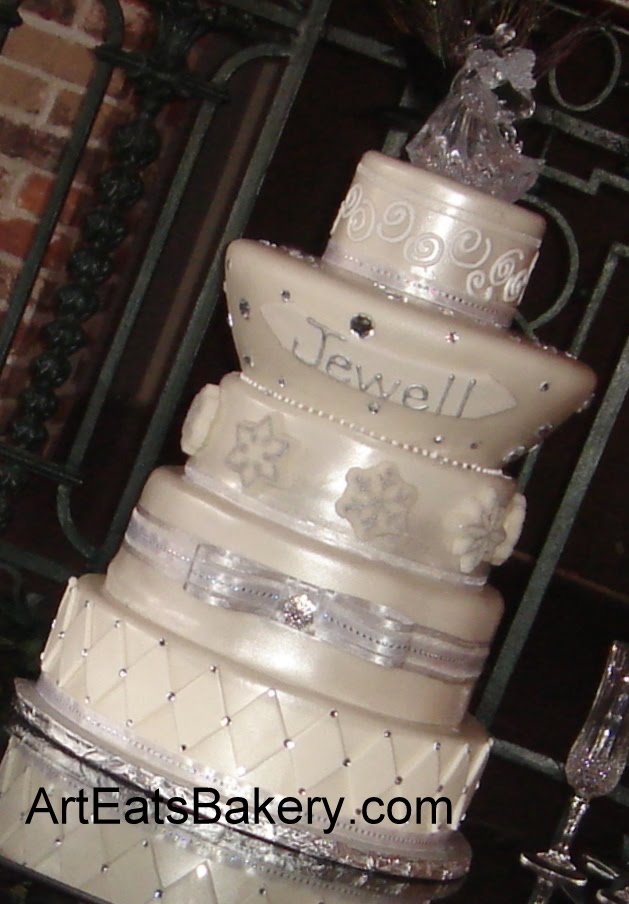 Five tier custom designed silver pearl wedding cake with sugar snowflakes 