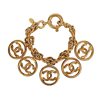 Vintage 1990's gold Chanel charm bracelet with "CC" logo charms 