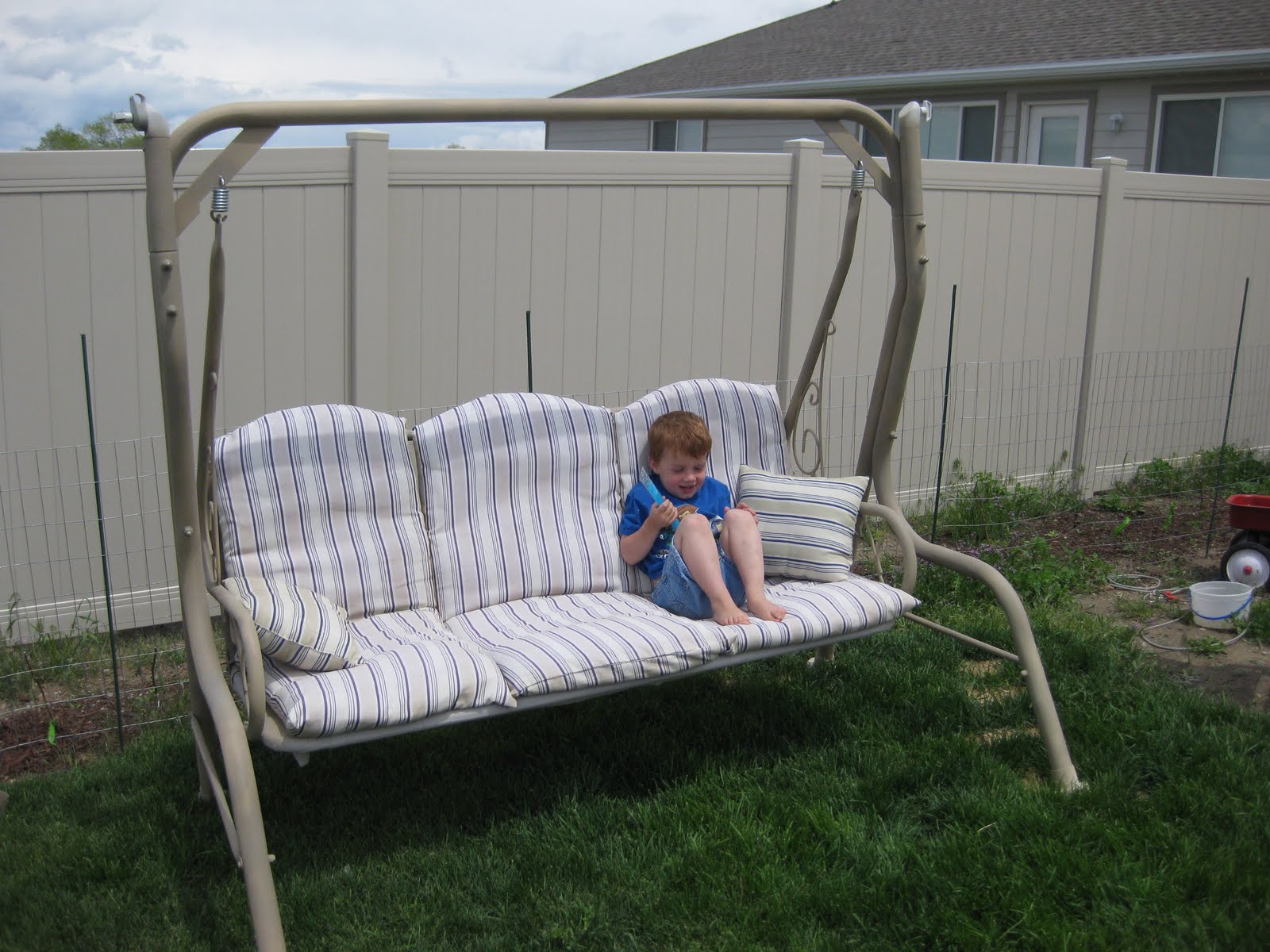 4 Growing Boys Patio Swing Redo....