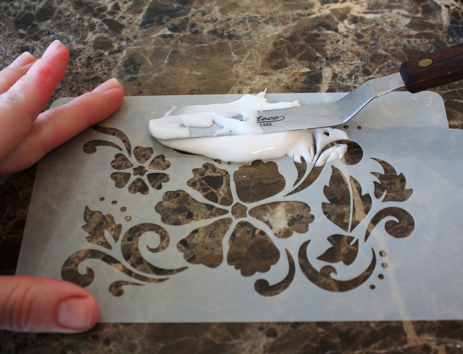 using a stencil on a cookie LilaLoa using a stencil on a cookie