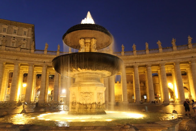 A close up look at the St Peter's fountain with Apostolic Palace at the background in Vatican City, Rome, Italy A close up look at the St Peter's fountain with Apostolic Palace at the background in Vatican City, Rome, Italy