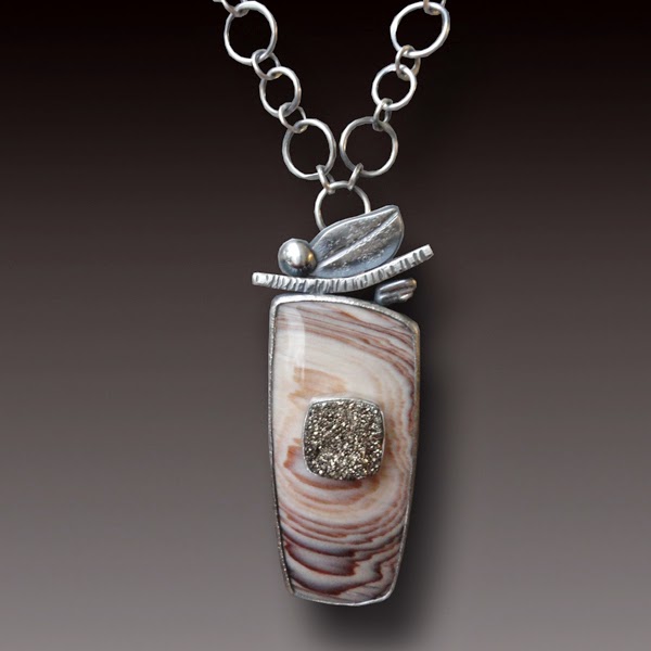 http://beatasasik.indiemade.com/product/hells-canyon-petrified-wood-necklace-sterling-silver-and-titanium-druzy?tid=16