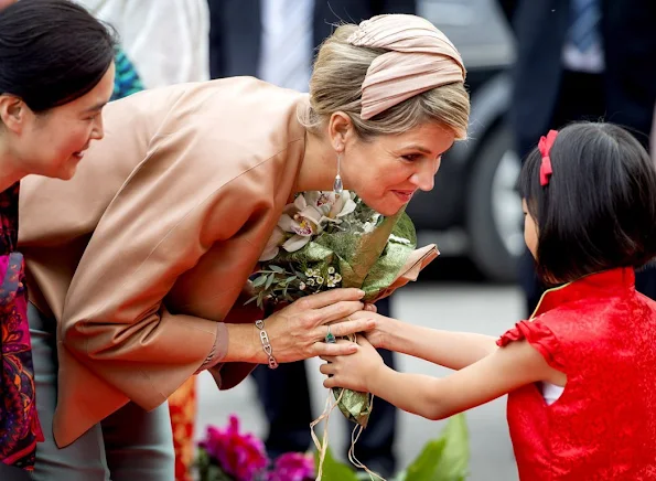 Queen Maxima and King Willem-Alexander of The Netherlands visit the Sino-Dutch Diary Development Center on October 25, 2015 in Beijing, China.