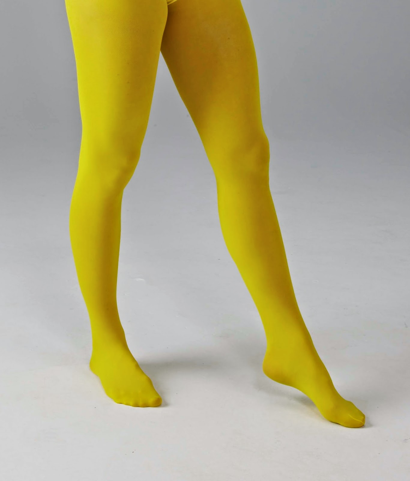 Women`s Legs and Feet in Tights Legs and Feet in Yellow Tights