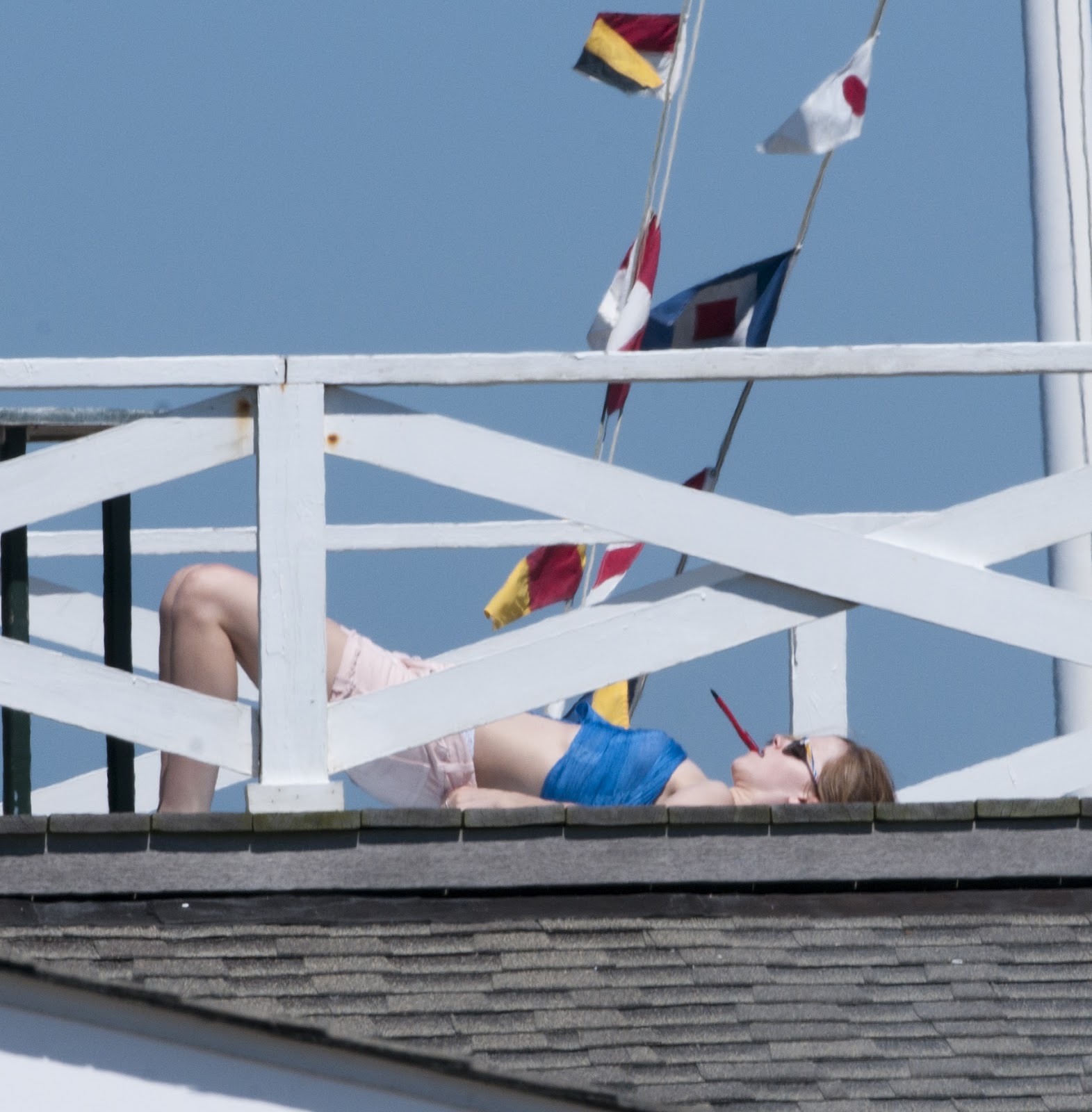 Celebrity Candids: Emma Watson - laying out in her 