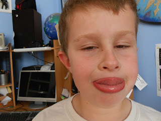 boy sticking tongue out for silly face