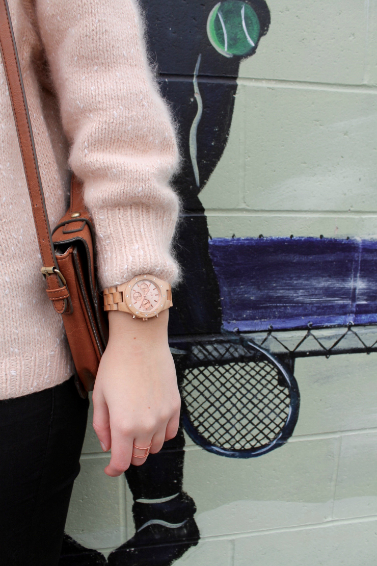 Peach colored angora sweater, black skinny jeans and classic woooden watch