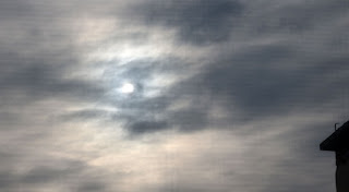 The sun attempting to break through the clouds The sun attempting to break through the clouds