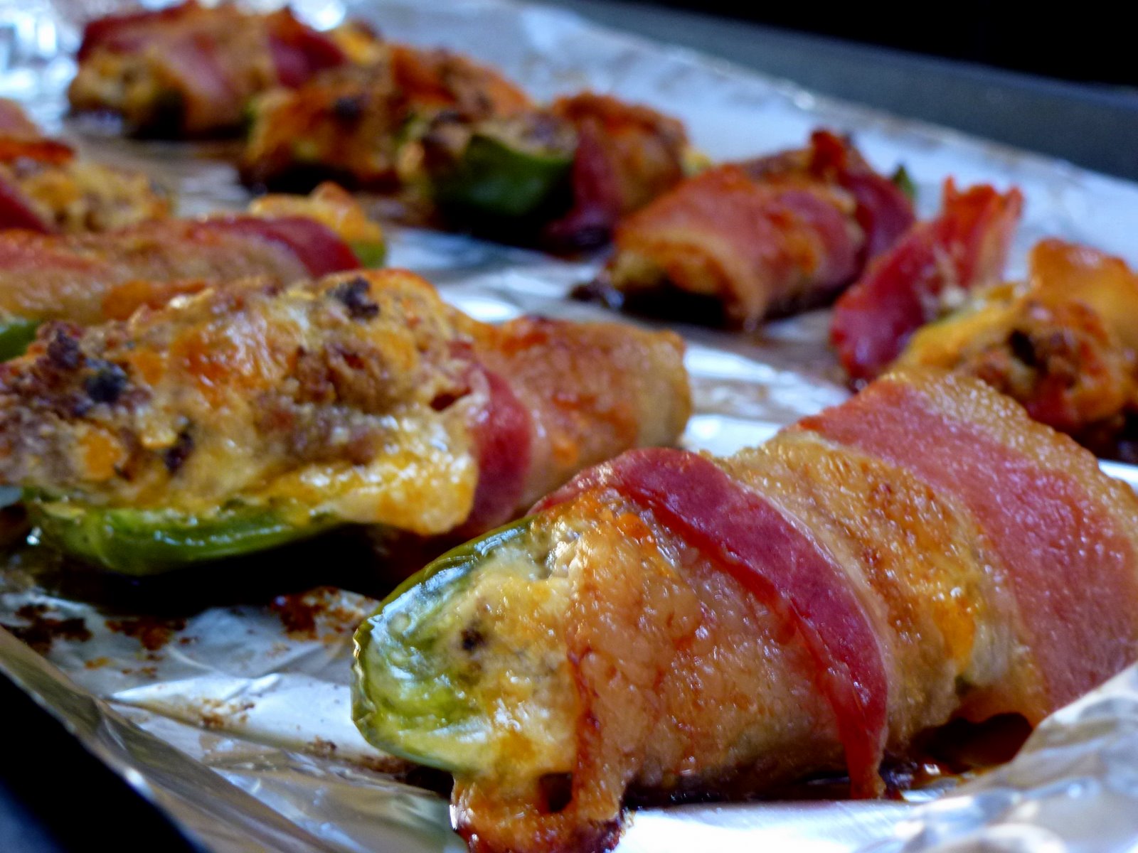 Hardly Housewives Sausage Stuffed Bacon Wrapped Jalapeno Poppers