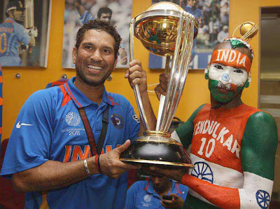 Sachin tendulkar and Sudhir Kumar Chaudhary holding the world cup Sachin tendulkar and Sudhir Kumar Chaudhary holding the world cup