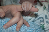 Mothers hold their child's hands for a short while, but their hearts forever.