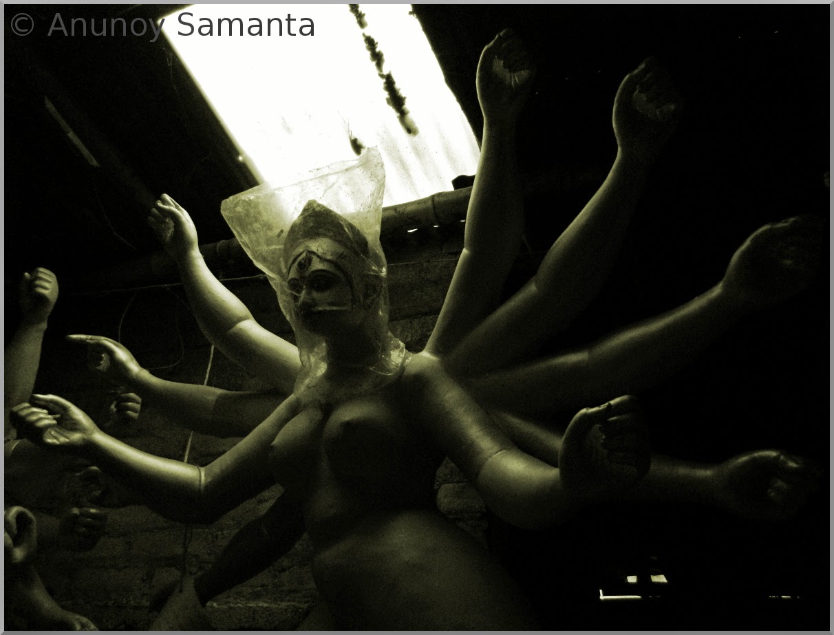 Durga Puja 2014 - Artisans busy in Painting of Idols