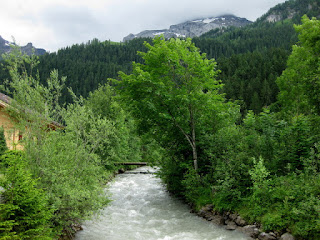 Fast-flowing River Simme, heading upstream toward the mountains, Lenk, Switzerland