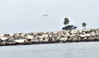 UFO Sightings Dark Disc UFO Caught Hovering Over California Beach, UFO Sightings