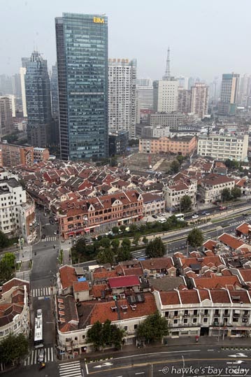 Dense housing and office blocks, also a vacant section from demolished buildings, probably for another skyscraper, view from my hotel, Hyatt on the Bund Dense housing and office blocks, also a vacant section from demolished buildings, probably for another skyscraper, view from my hotel, Hyatt on the Bund photograph