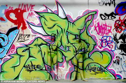 Hot naked girl fingering herself Naked woman covered in graffiti
