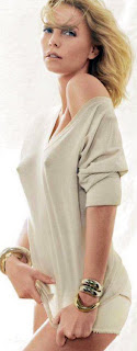 Charlize Theron looks hot wearing only a sweater