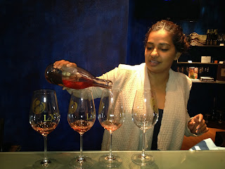 Neeta Mittal of LXV pours.